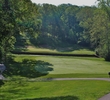 The green of the par-4 third hole on the Woodlands nine at Shaker Run Golf Club is tucked behind a stream. 