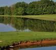 It's an intimidating tee shot on the ninth hole of the Lakeside nine at Shaker Run Golf Club in Lebanon, Ohio. 